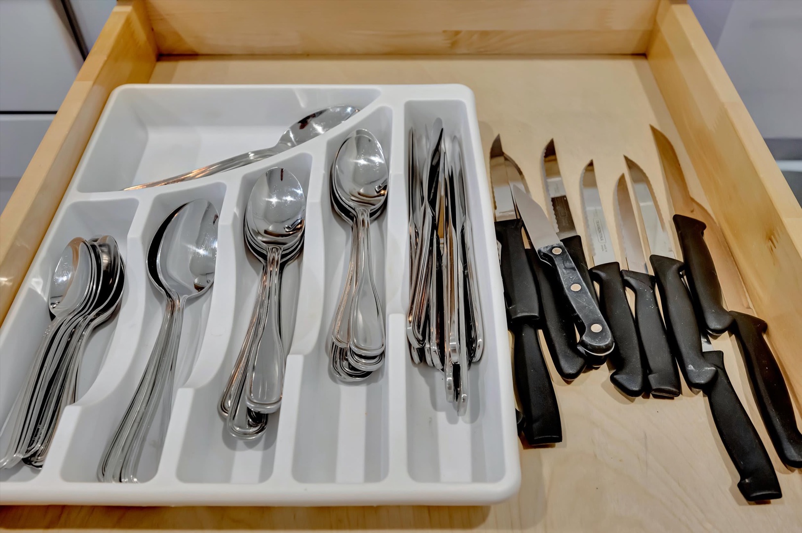 Your fully equipped kitchen drawer awaits, stocked with quality cutlery and professional knives ready for preparing delicious home-cooked meals during your stay.