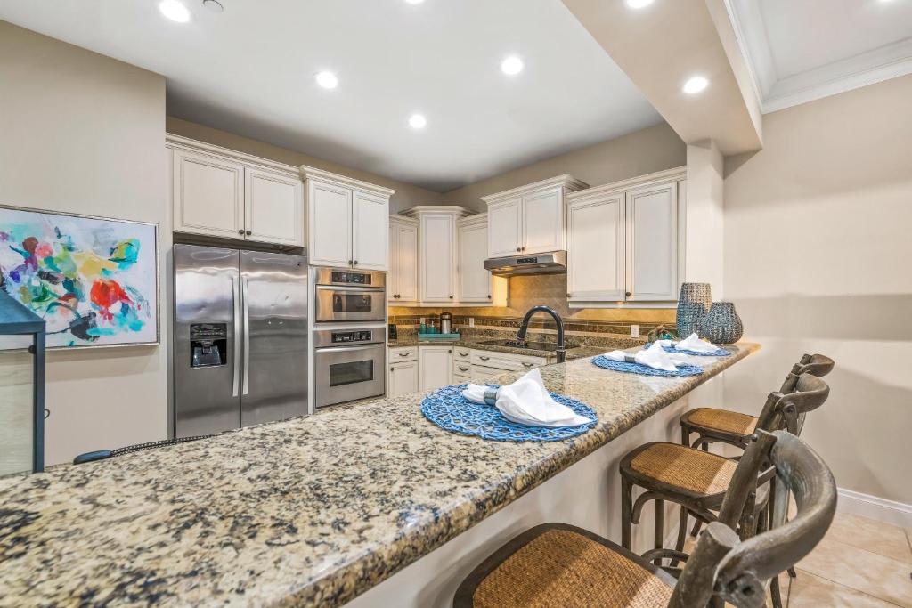 Your gourmet kitchen awaits, complete with gleaming granite counters, stainless steel appliances, and plenty of space to whip up vacation meals together.