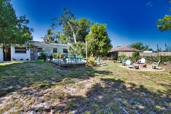 The property sits on a spacious lot with mature trees providing natural shade and a peaceful, neighborhood setting for your stay.
