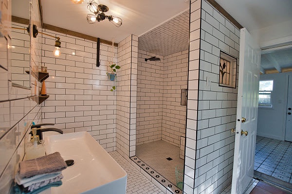 Step into your bright, modern bathroom featuring crisp subway tile and a spacious walk-in shower. The sleek design and quality finishes make your daily routine feel a little more luxurious.