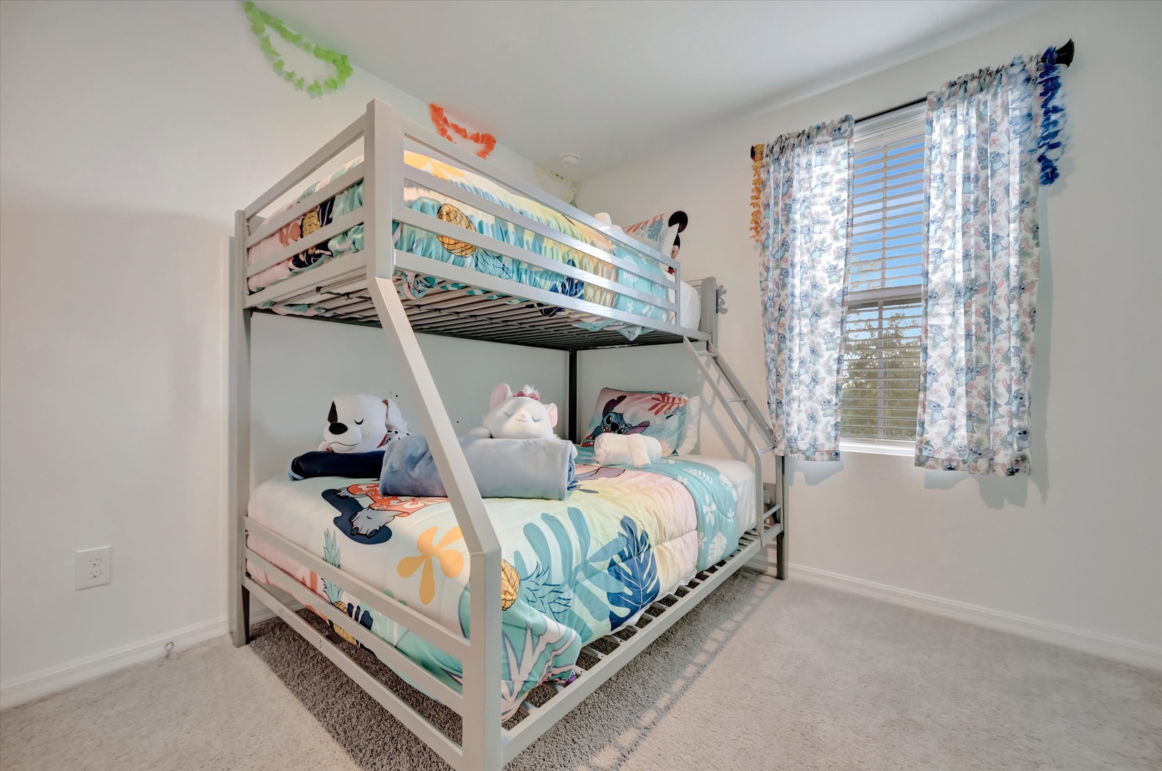 Your little ones will love bunking down in this cheerful bedroom, complete with a cozy bunk bed and bright tropical bedding that sets the stage for fun vacation memories.