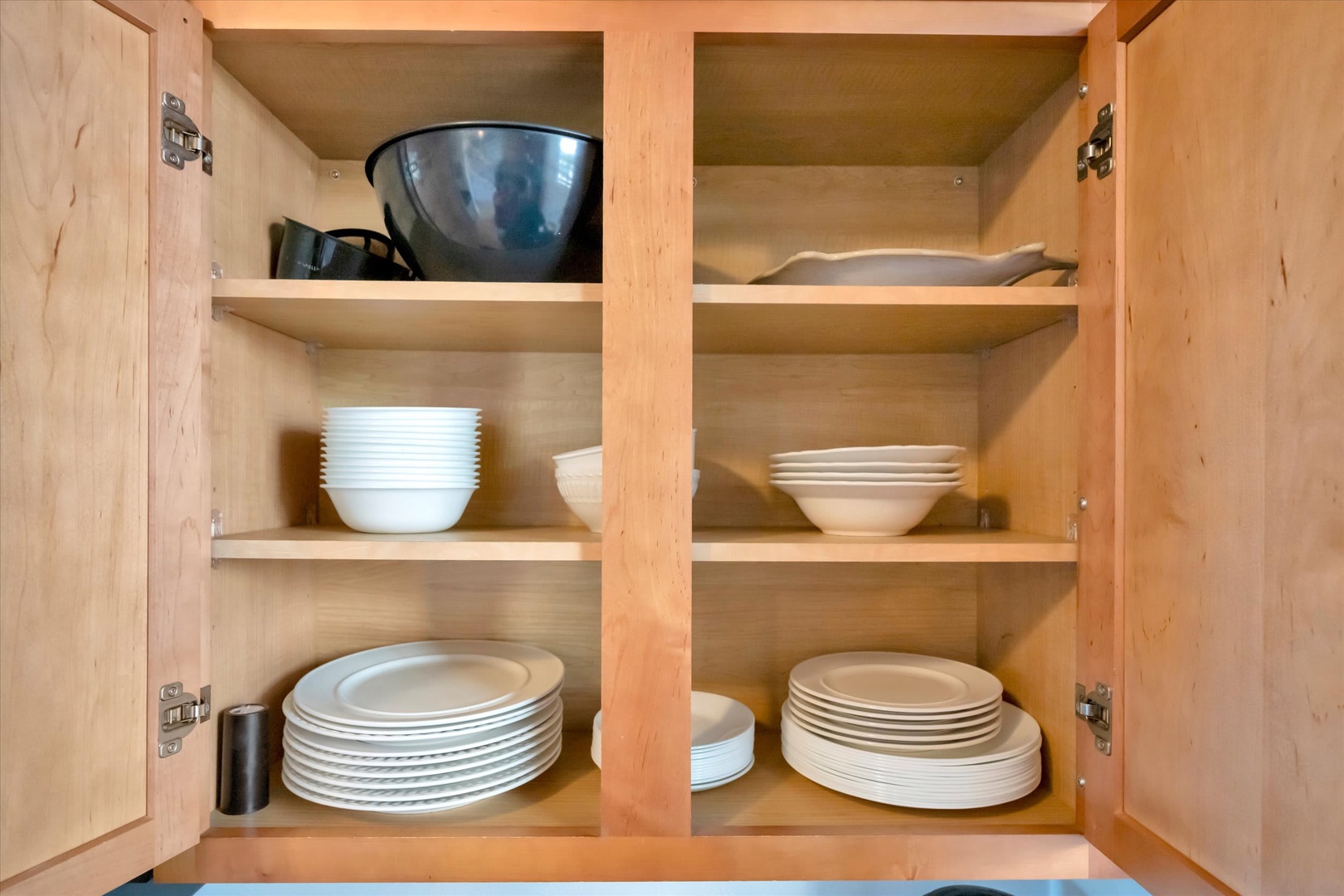 Your kitchen is fully stocked with dishes, bowls, and serveware—everything you need to prepare and enjoy meals together during your stay.