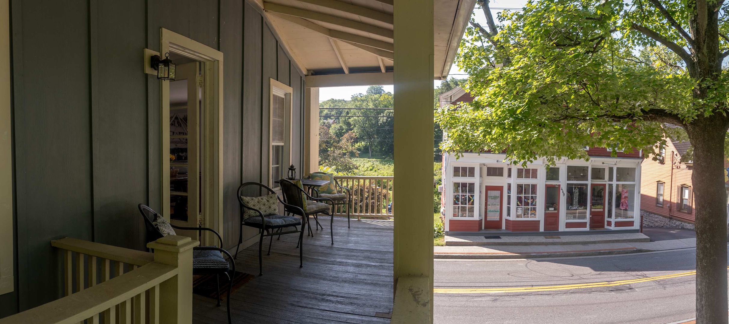 Relax on the covered front porch with wooded views and easy access to the charming downtown area.