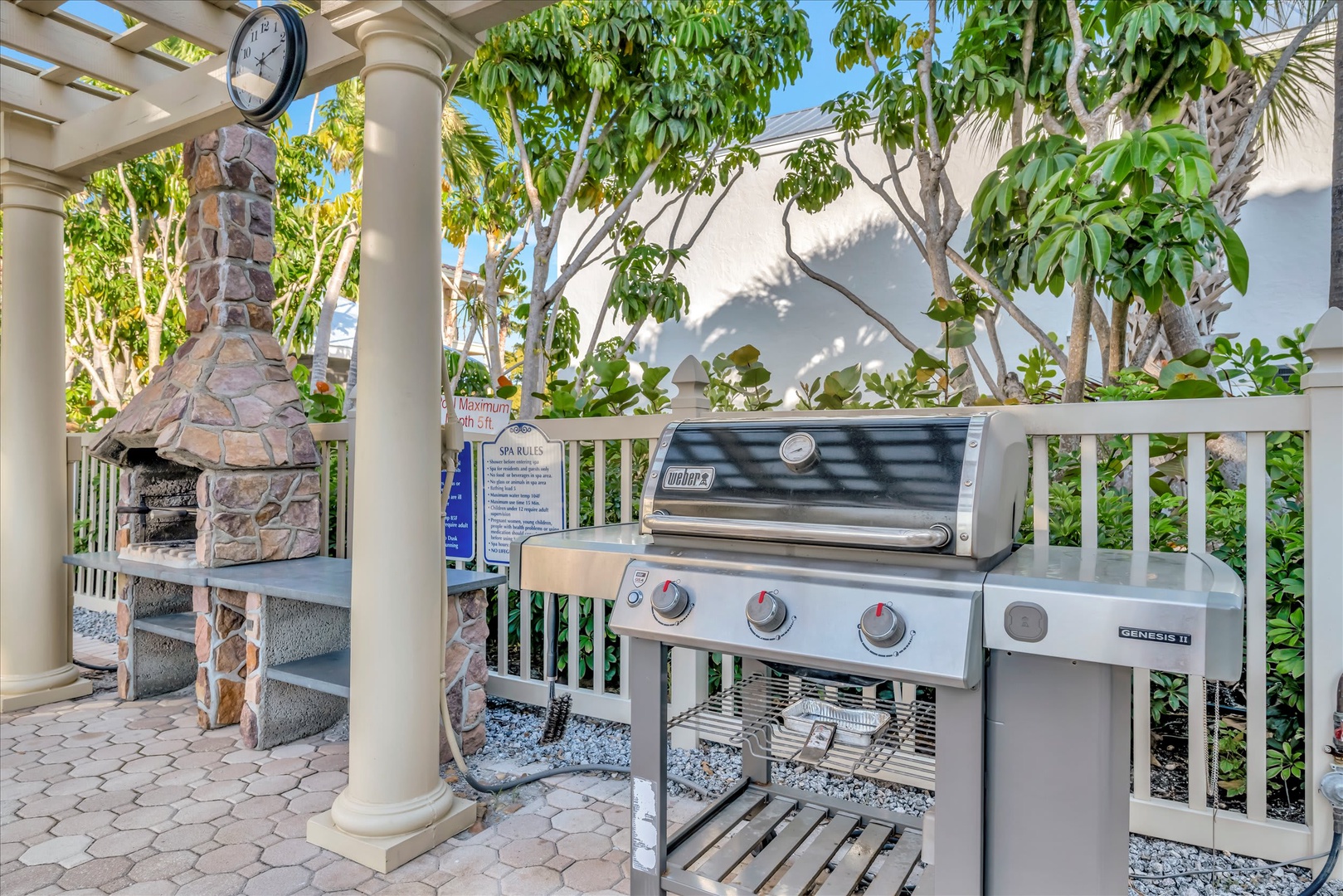 Fire up the grill for a cookout in your private outdoor space, complete with a stone pizza oven and tropical garden surroundings—perfect for relaxed island-style dining.