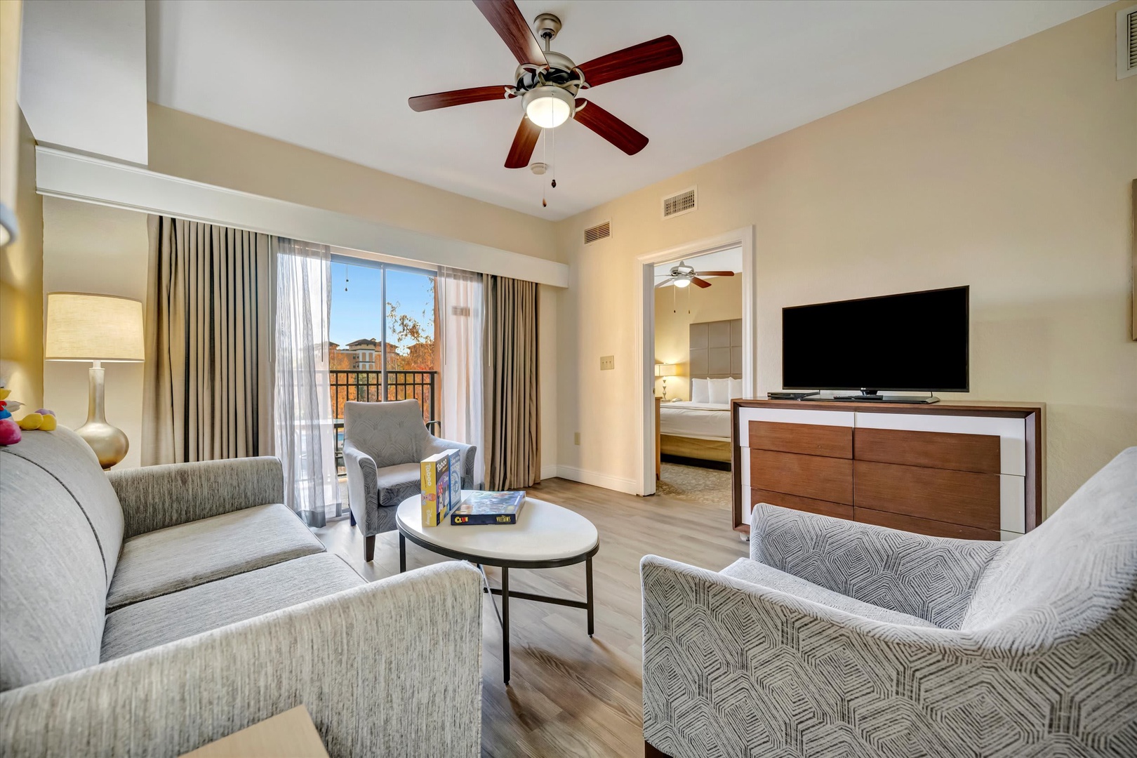 Unwind in your bright, open living space with stylish seating and a private balcony awaiting just beyond the glass doors.