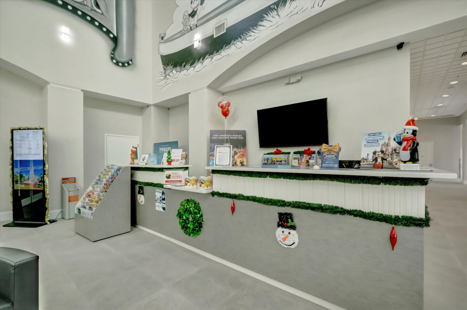 The festive lobby welcomes you with cheerful holiday decorations and a friendly reception desk ready to help make your stay memorable.
