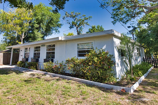 Welcome to your peaceful retreat, nestled among mature trees and lush greenery in a quiet neighborhood. The property's charming mid-century design and spacious layout await your arrival.