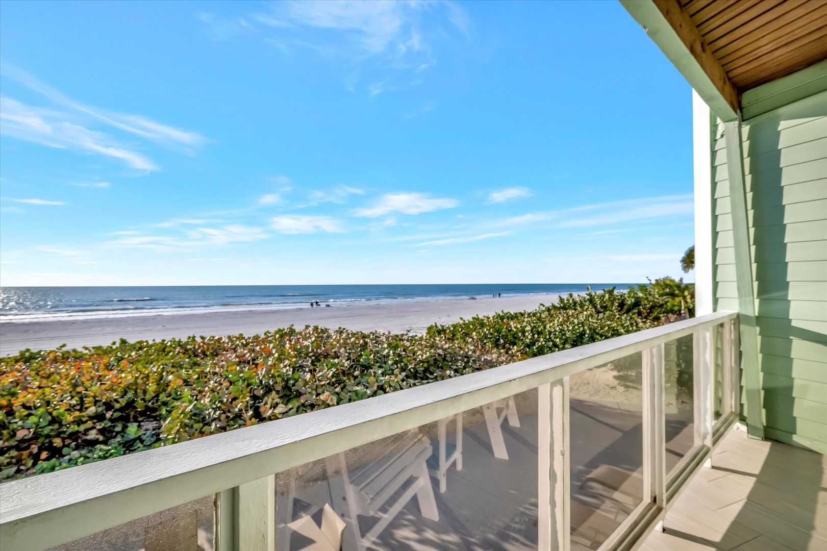 Coastal serenity awaits from this private beachfront balcony. Wake to ocean breezes, endless blue horizons, and the soothing sound of waves just steps away.