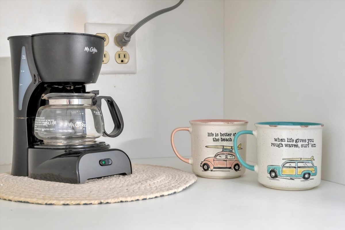 Start your morning with freshly brewed coffee from your in-room coffee maker, complete with beach-themed mugs to set the perfect vacation tone.