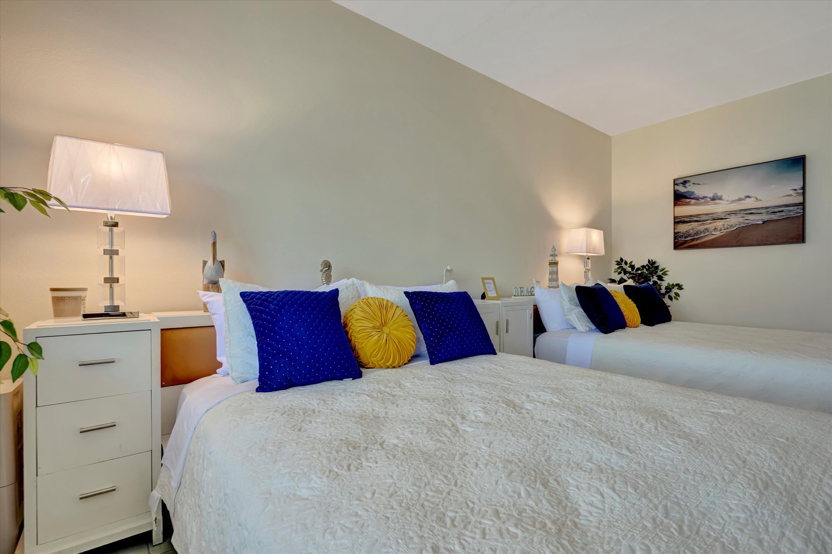 Sink into plush bedding and let the soft lighting and coastal touches help you unwind after a day of exploring. Your restful retreat awaits.