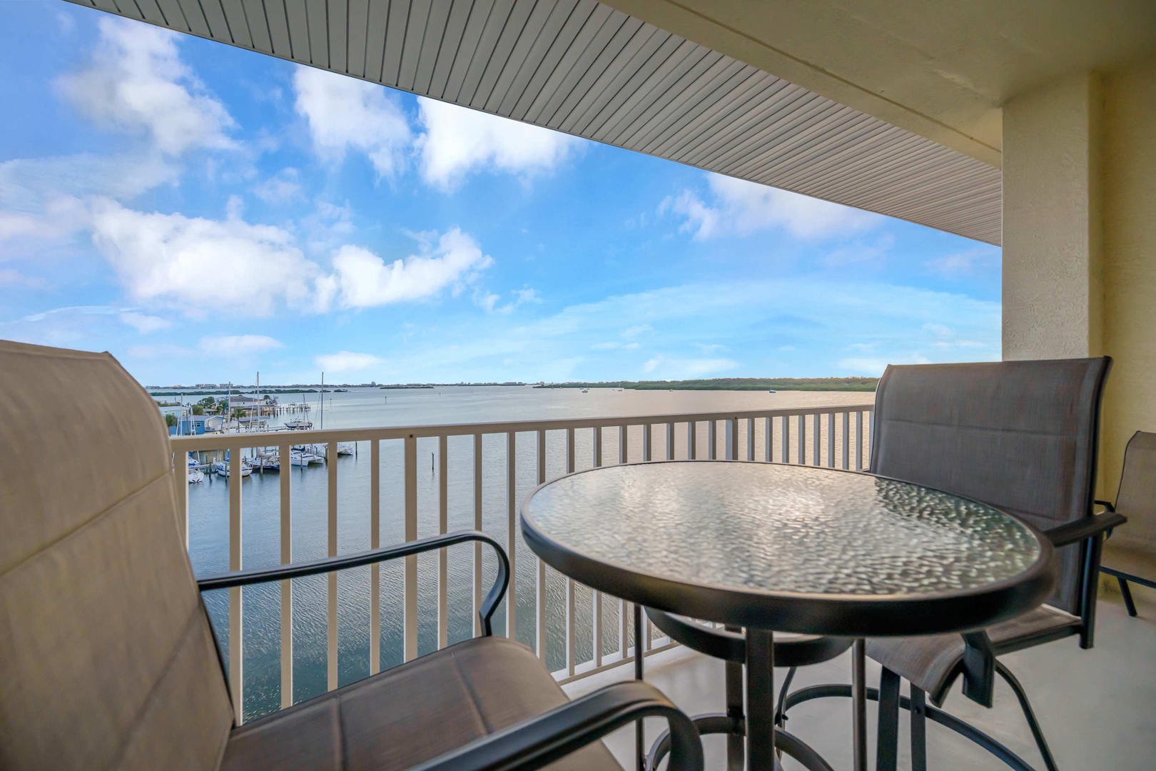 Sip your morning coffee on your private waterfront balcony, where peaceful marina views and open skies create the perfect backdrop for unwinding after a day of adventure.