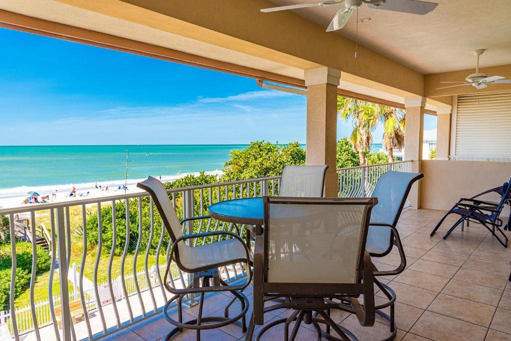 Step onto your private balcony and breathe in the salty ocean air. The turquoise waters stretch endlessly before you, framed by swaying palms and soft white sand—your perfect escape awaits.