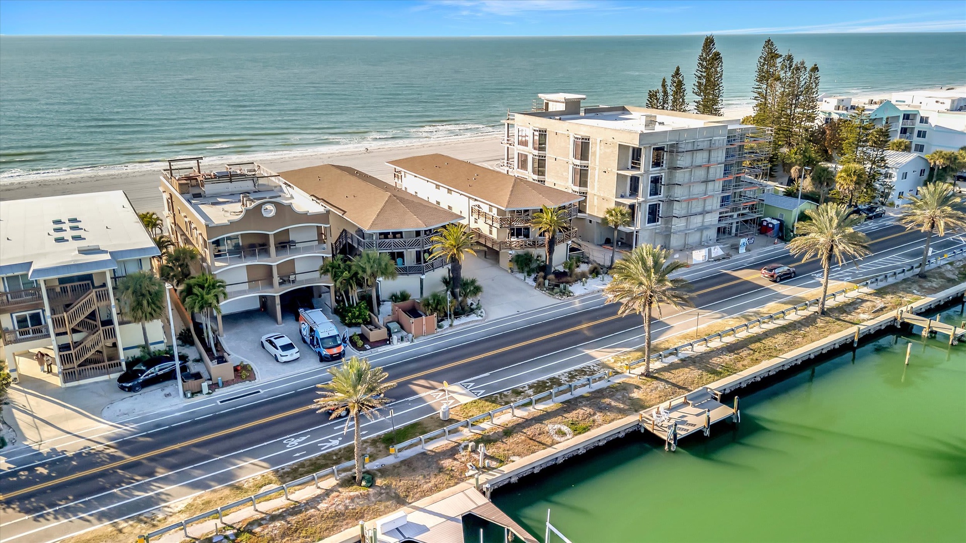 Beachfront property nestled between the Gulf of Mexico and calm bay waters, offering easy coastal access and scenic waterfront surroundings.