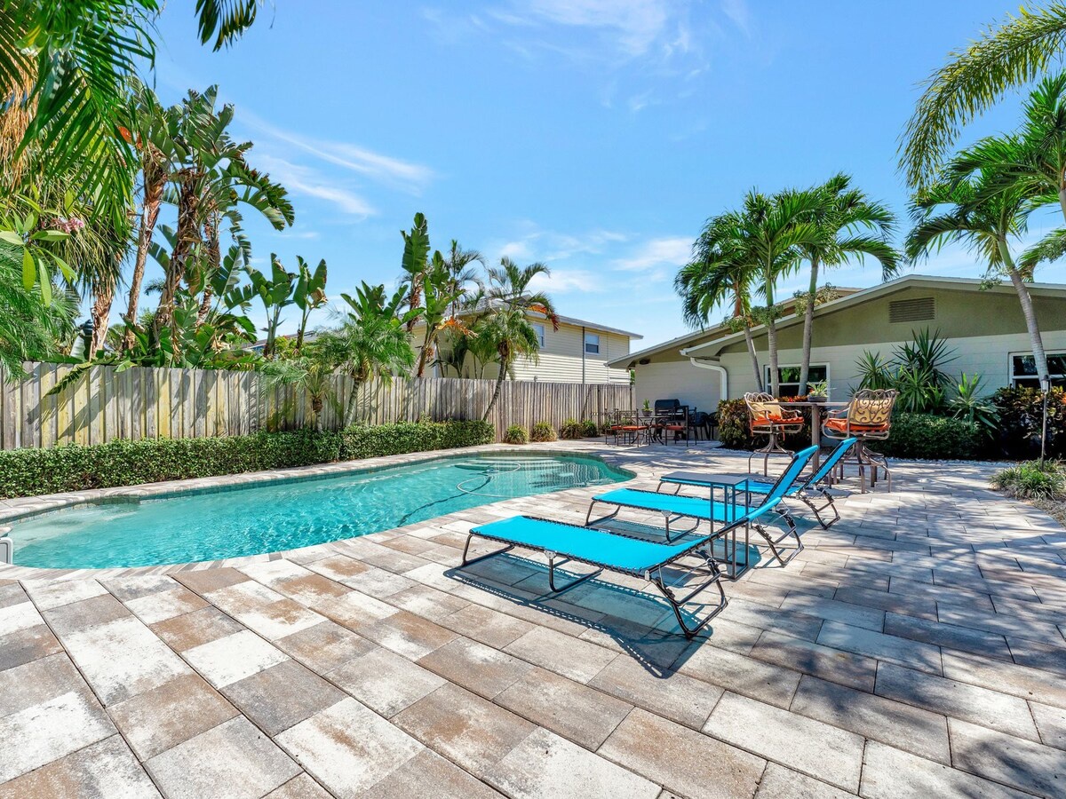 A private oasis awaits in this sun-drenched backyard. Lounge poolside under swaying palms, fire up the grill for an evening cookout, and unwind beneath open skies in your own tropical paradise.