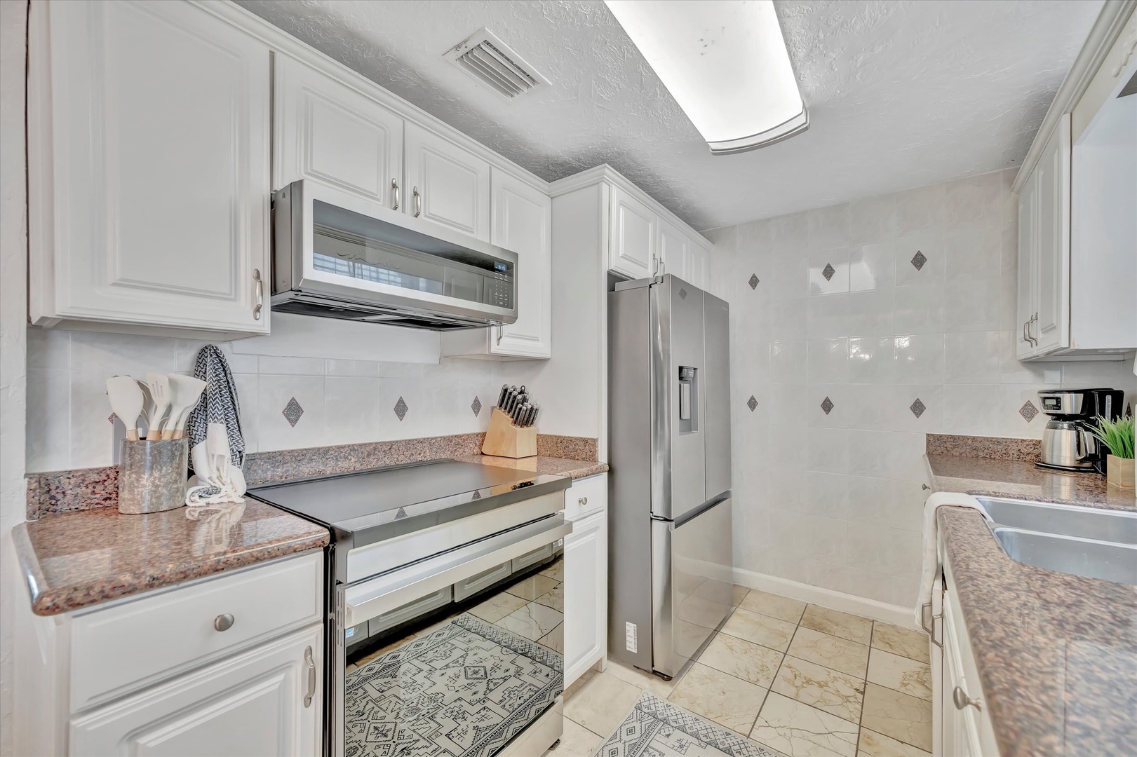 Your fully-equipped kitchen awaits with stainless steel appliances, granite countertops, and everything you need to whip up a quick breakfast or prepare a memorable vacation meal.