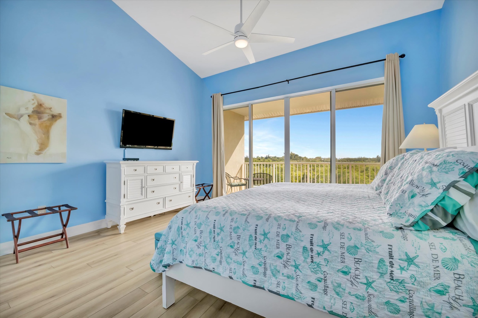 Wake up to sweeping natural landscape views from your bright, coastal bedroom where a ceiling fan keeps you comfortable. Step onto your private balcony and breathe in the fresh air.