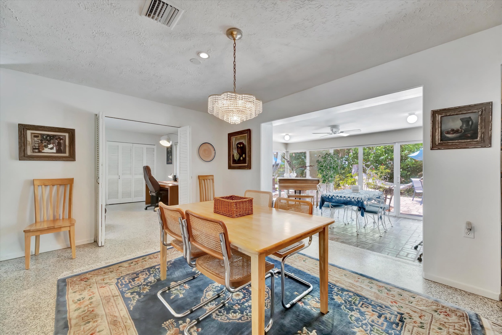 Your bright, welcoming dining space flows effortlessly to the sunny patio, where meals become moments and gatherings feel easy and natural.