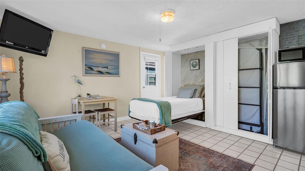 Settle into your airy, beach-inspired studio where coastal tones and thoughtful touches create a relaxing retreat. Your kitchenette and cozy seating area invite you to unwind after a day of seaside adventures.