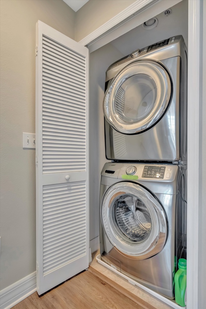This in-unit washer and dryer setup makes laundry effortless, with a sleek stacked design tucked neatly into its own space for your convenience.