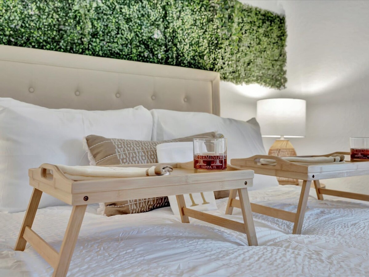 Imagine waking up to breakfast in bed beneath a lush living wall. Fresh greenery overhead creates a serene, spa-like retreat where your mornings start with pure relaxation.
