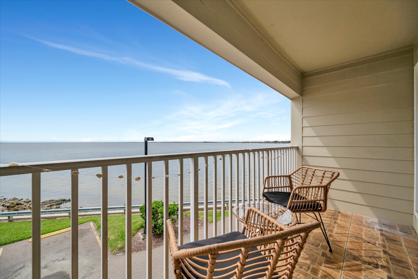 Picture yourself unwinding on your private balcony, where comfortable seating and breathtaking sea views create the perfect spot to watch the waves and feel the coastal breeze.