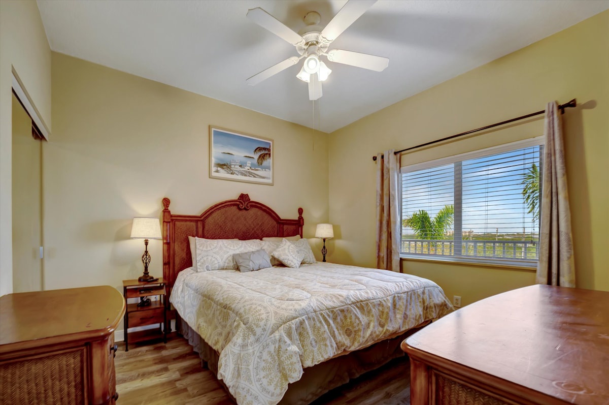 Wake up to swaying palms and tropical breezes in your sun-lit island retreat, where warm wood tones and coastal charm invite you to truly relax and unwind.