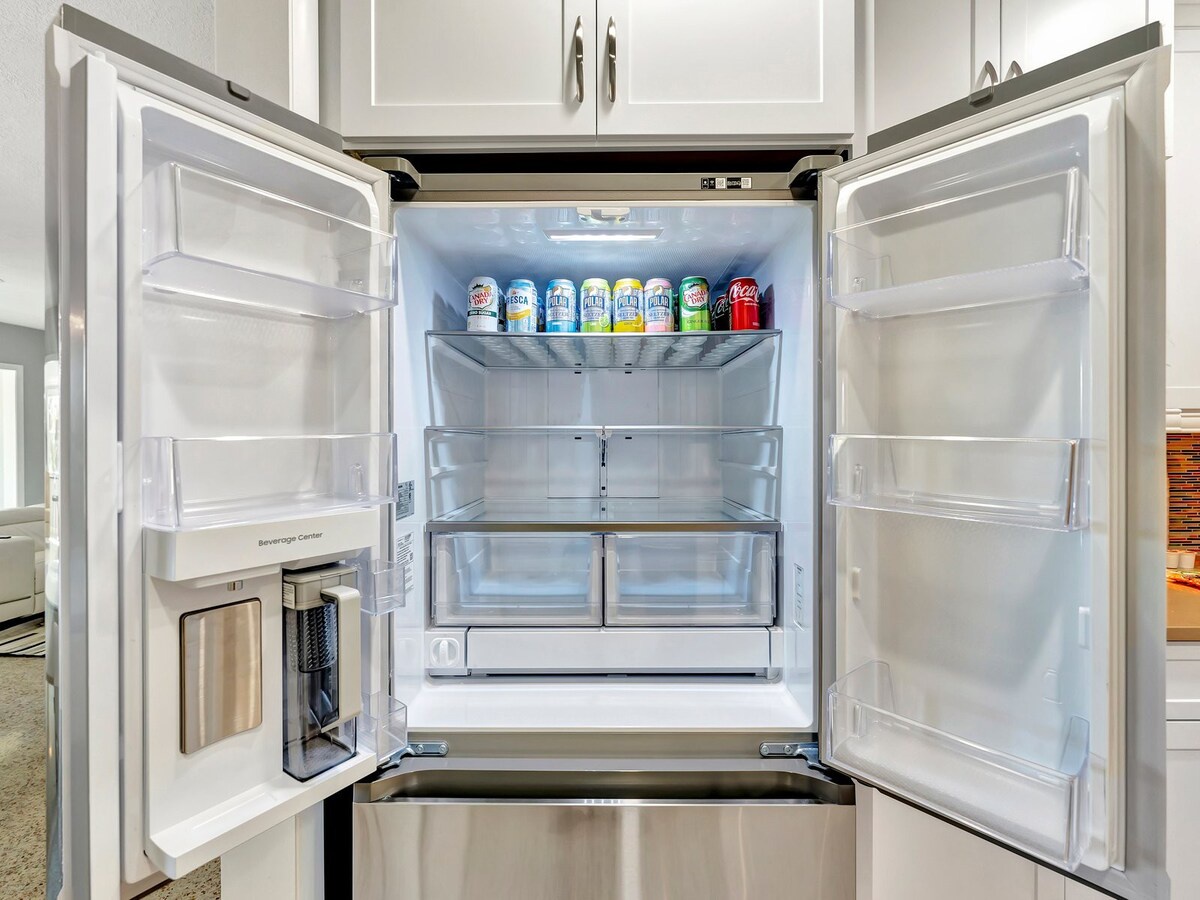 Your fridge is stocked with refreshing drinks and plenty of space for your favorites. Enjoy convenient storage in this bright, modern kitchen designed for your comfort.