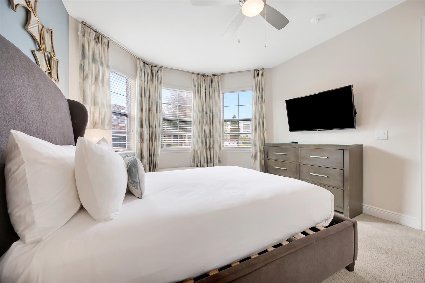 Sink into crisp linens and let natural light fill your bright, airy bedroom. Warm neutral tones and thoughtful touches create a serene retreat for restful nights.