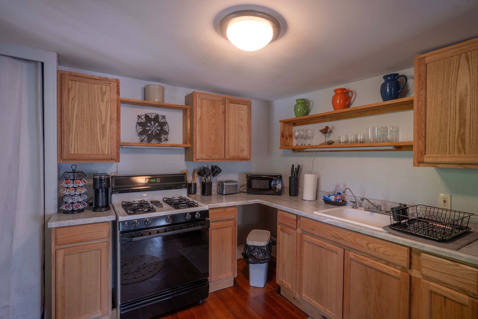 A fully equipped kitchen awaits your culinary adventures, complete with a gas range, microwave, and all the essentials you'll need to whip up your favorite meals during your stay.