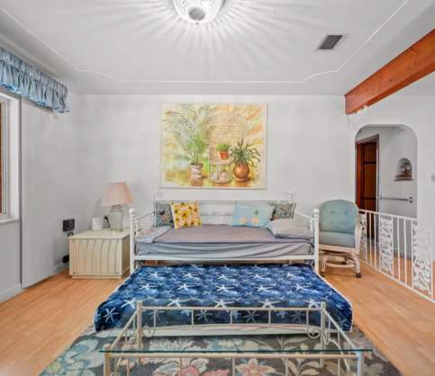Relax in your serene retreat with twin beds bathed in natural light. Coastal artwork and soft colors create a peaceful seaside vibe, perfect for unwinding after a day of adventure.