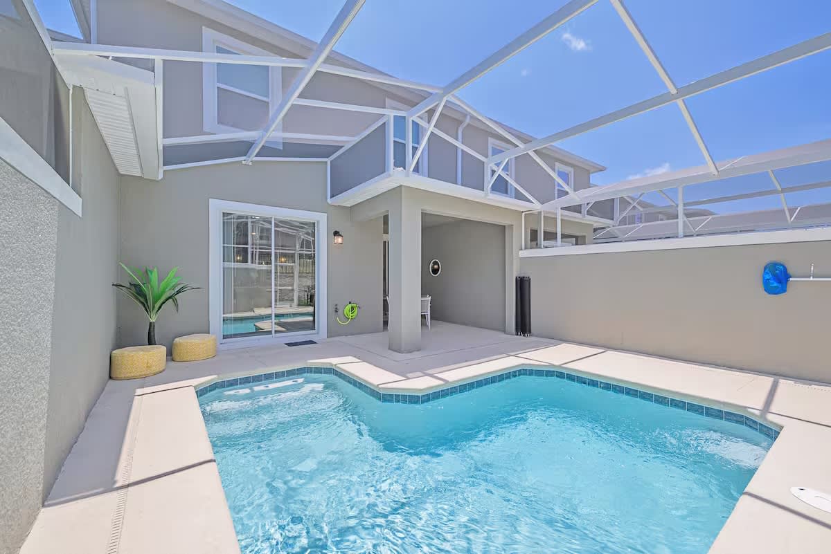 Your private screened pool awaits, sparkling under a sunny Florida sky. Step outside and dive in whenever the mood strikes—this refreshing oasis is all yours.