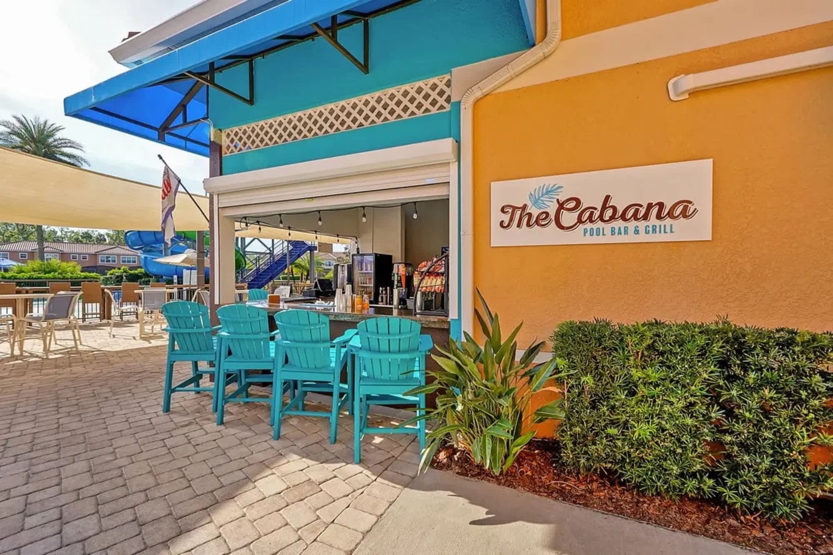 The Cabana Pool Bar & Grill offers a vibrant tropical escape with colorful architecture, refreshing drinks, and relaxed outdoor seating—perfect for casual poolside dining during your stay.