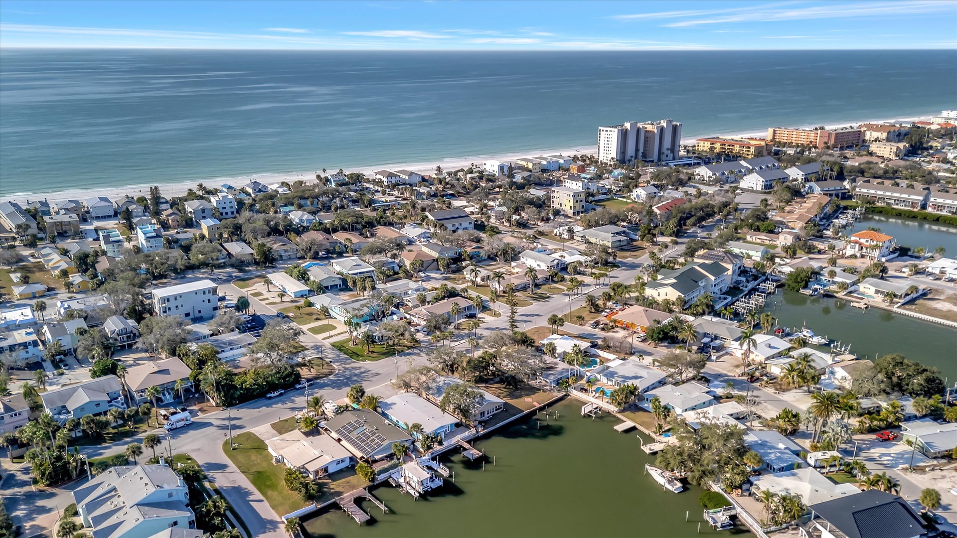 An aerial view showcasing the beachfront community with ocean access and nearby coastal amenities.