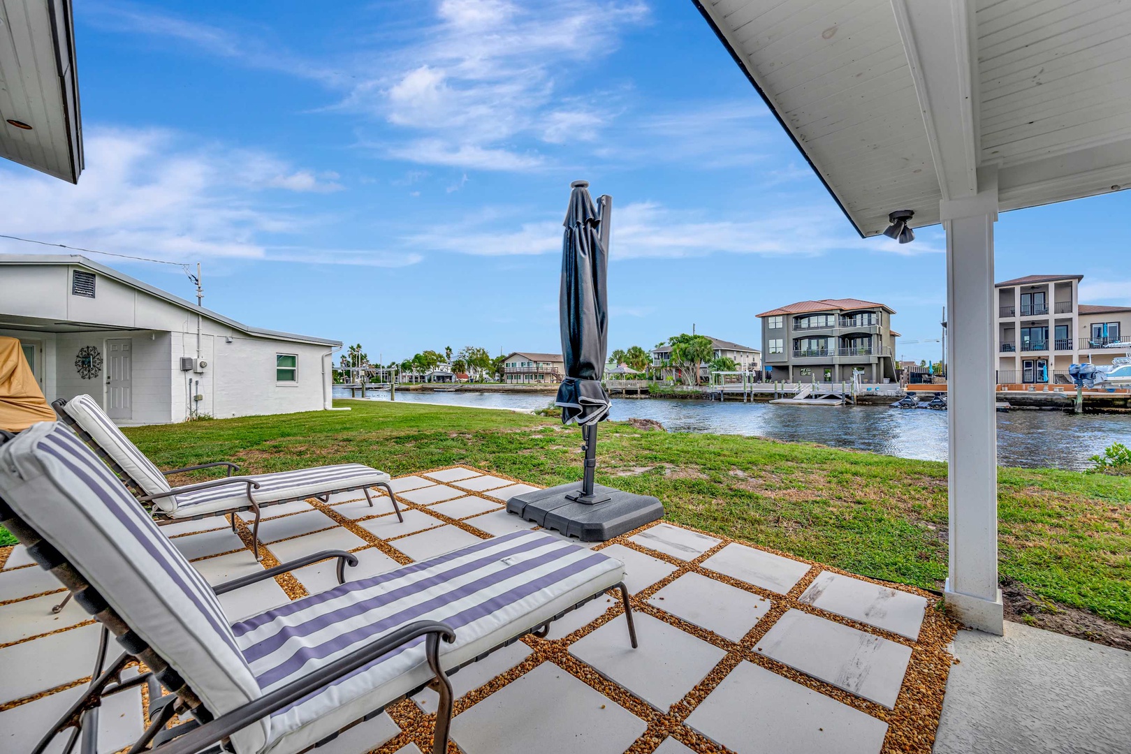 Stretch out on your private waterfront patio, where peaceful canal views and sunshine create the perfect backdrop for lazy afternoons. Your own slice of Florida living awaits.