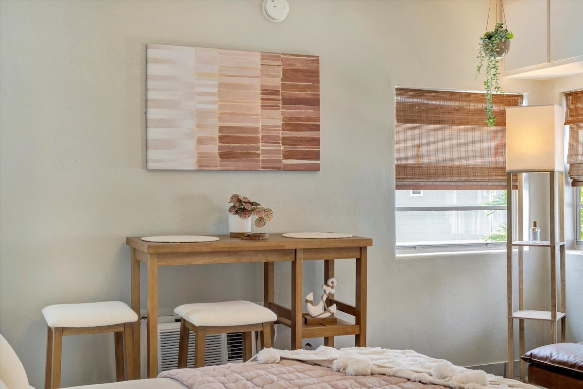 Soak in the warm, minimalist style of your private room, where natural wood tones and soft textiles create a peaceful retreat after a day of exploring.