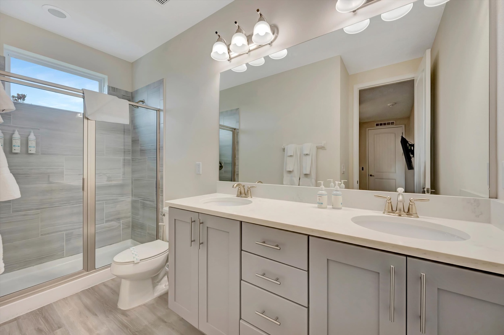 Step into your spa-like bathroom with sleek double vanity, sparkling fixtures, and a spacious walk-in shower—designed to make every morning feel refreshing and every evening relaxing.