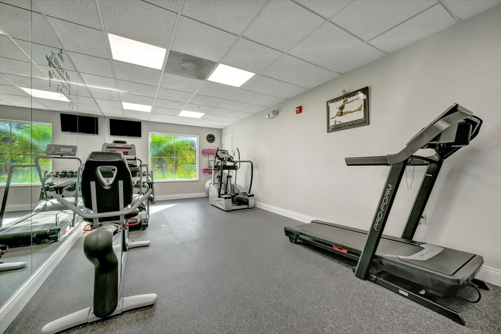 Stay active during your getaway in this bright fitness center featuring cardio machines, free weights, and natural daylight to energize your workout routine.