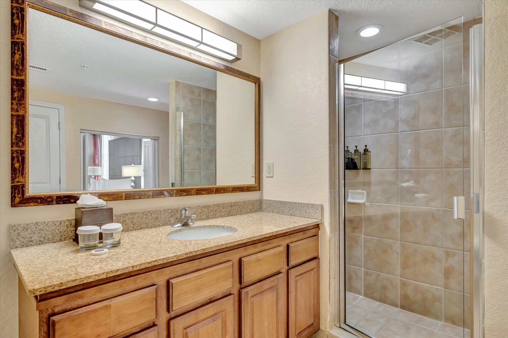 Step into your private bathroom, where a spacious walk-in shower awaits alongside granite countertops and thoughtful amenities to help you unwind.