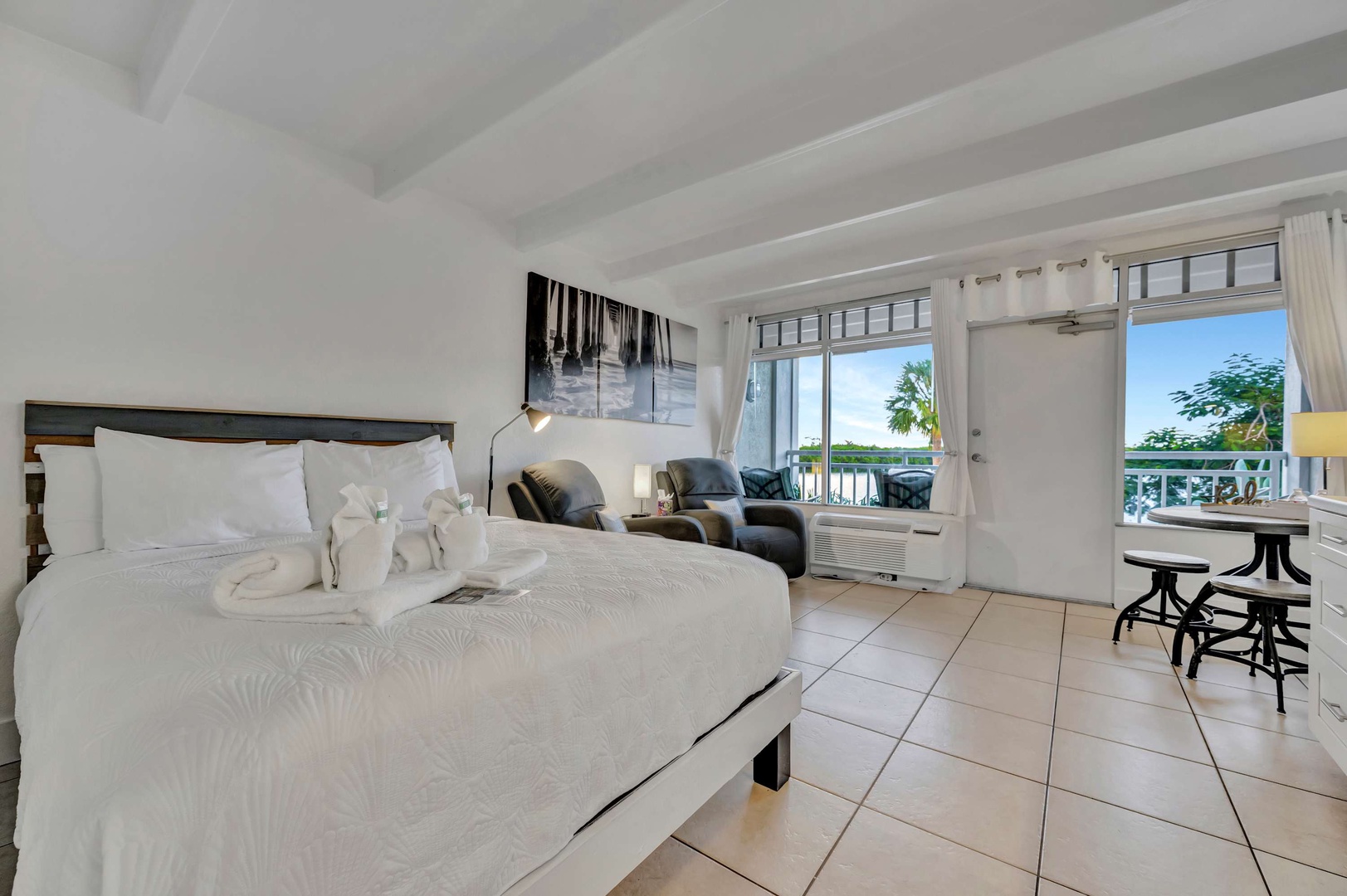 Sink into crisp linens and let ocean breezes drift through your balcony doors. Your private retreat features thoughtful touches and views of swaying palms.