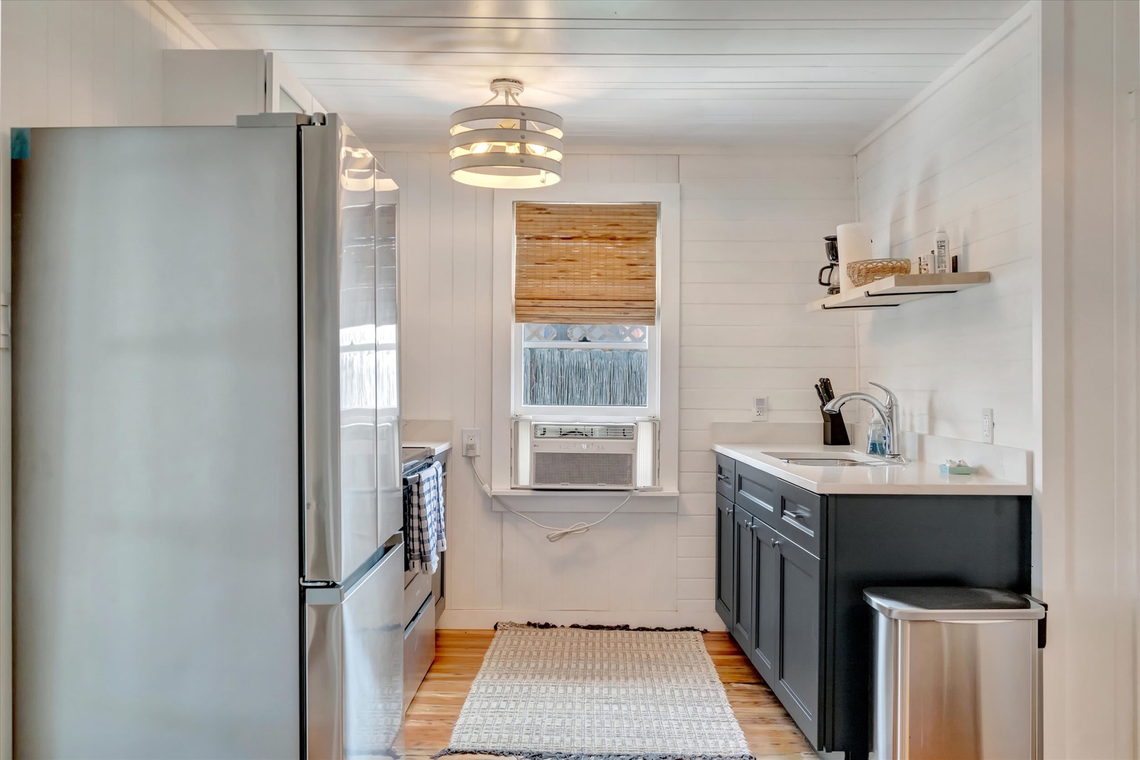 Your bright, fully-equipped kitchen has everything you need to prepare delicious meals, with modern appliances, ample counter space, and a charming coastal-inspired design that makes cooking a pleasure.