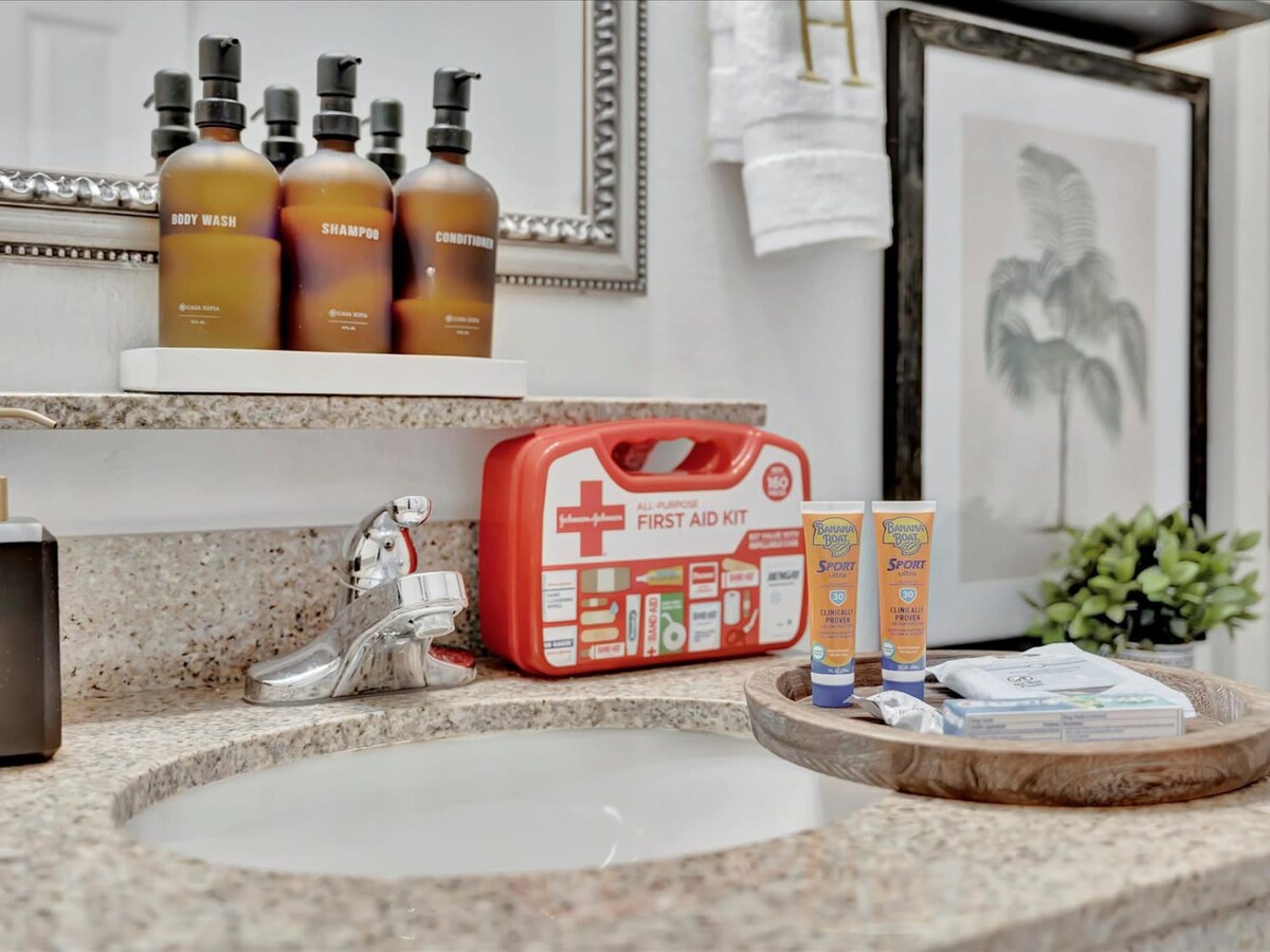 Thoughtful touches await in your bathroom—premium toiletries, a well-stocked first aid kit, and sunscreen ready for your adventures. Fresh towels and a beautifully styled vanity make every morning feel like a spa retreat.