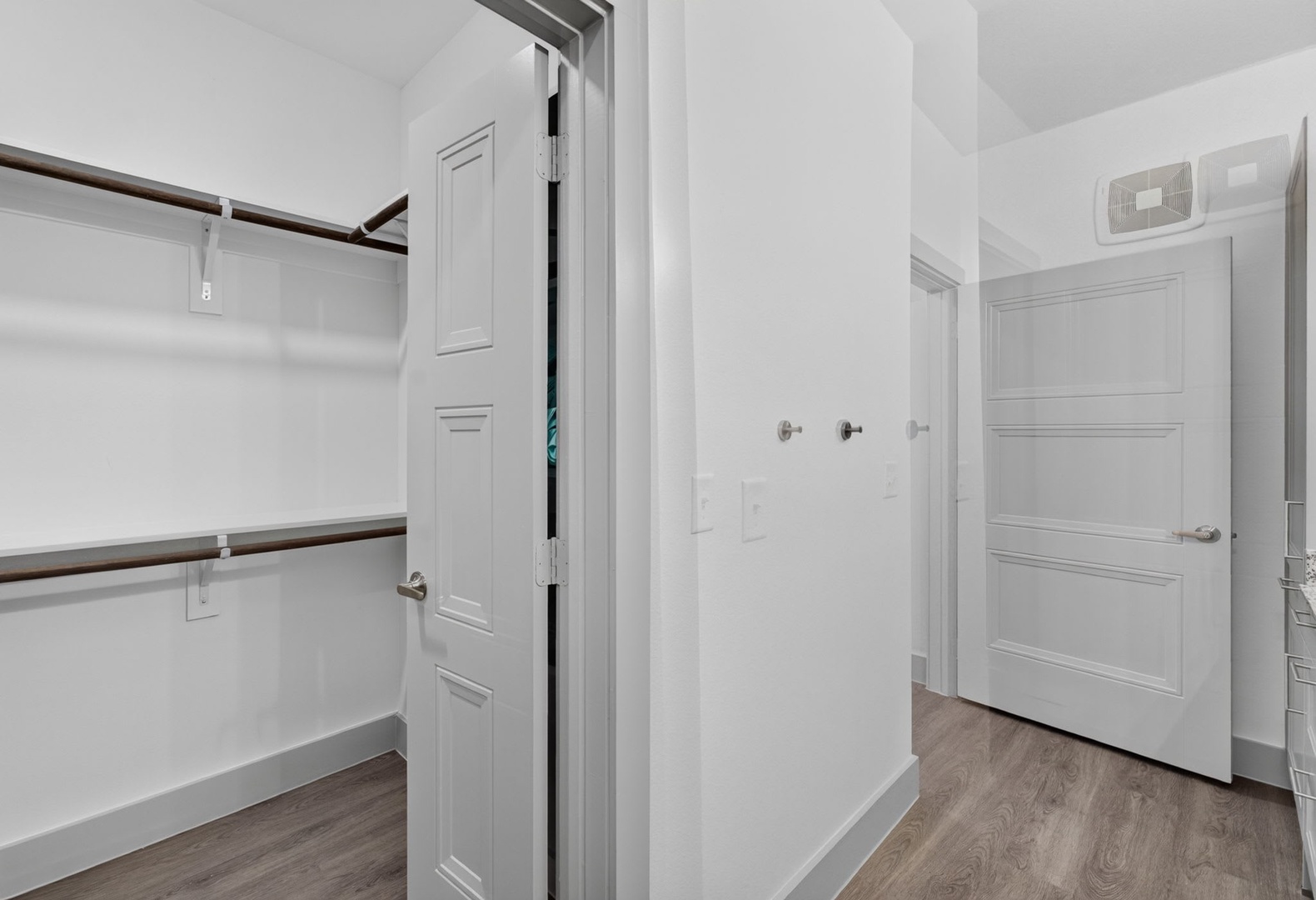 Your spacious walk-in closet offers generous storage with multiple levels of hanging space, keeping your wardrobe organized and accessible throughout your stay.