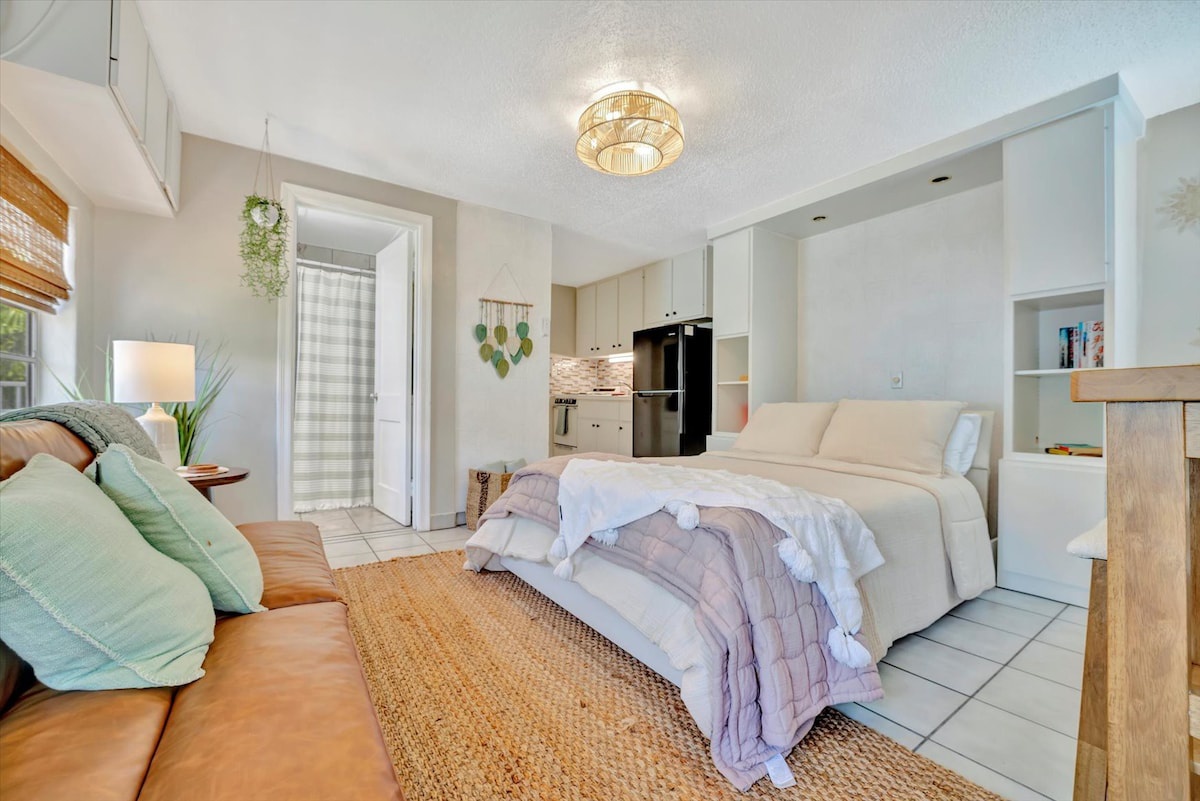 Settle into your cozy studio where everything you need is within reach—a plush bed, a sofa for lounging, and a fully-equipped kitchen for home-cooked meals. Soft natural light and coastal textures create the perfect retreat.