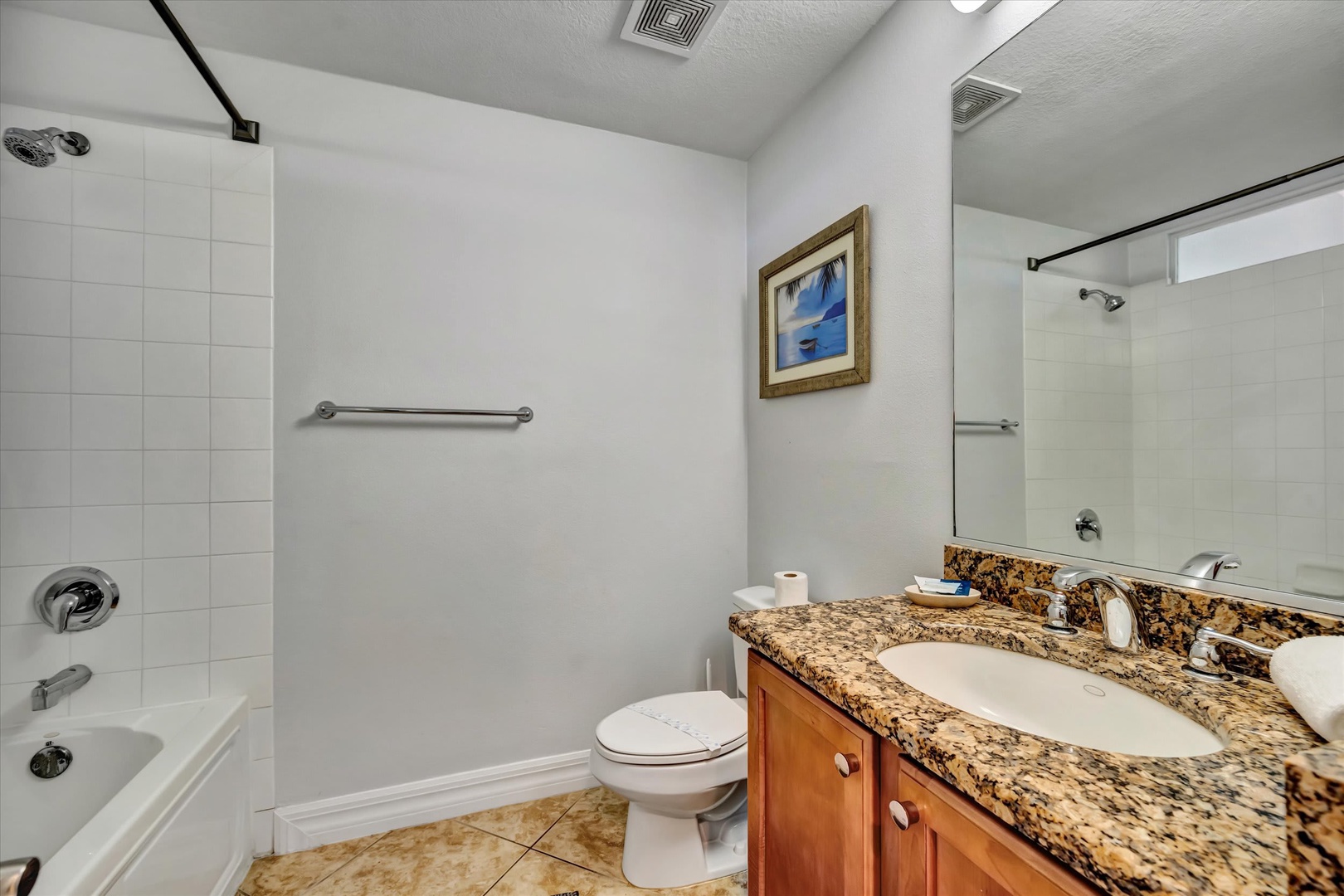 Step into your private bathroom with a granite-topped vanity, crisp white tiles, and modern fixtures—everything you need for a refreshing start to your day.