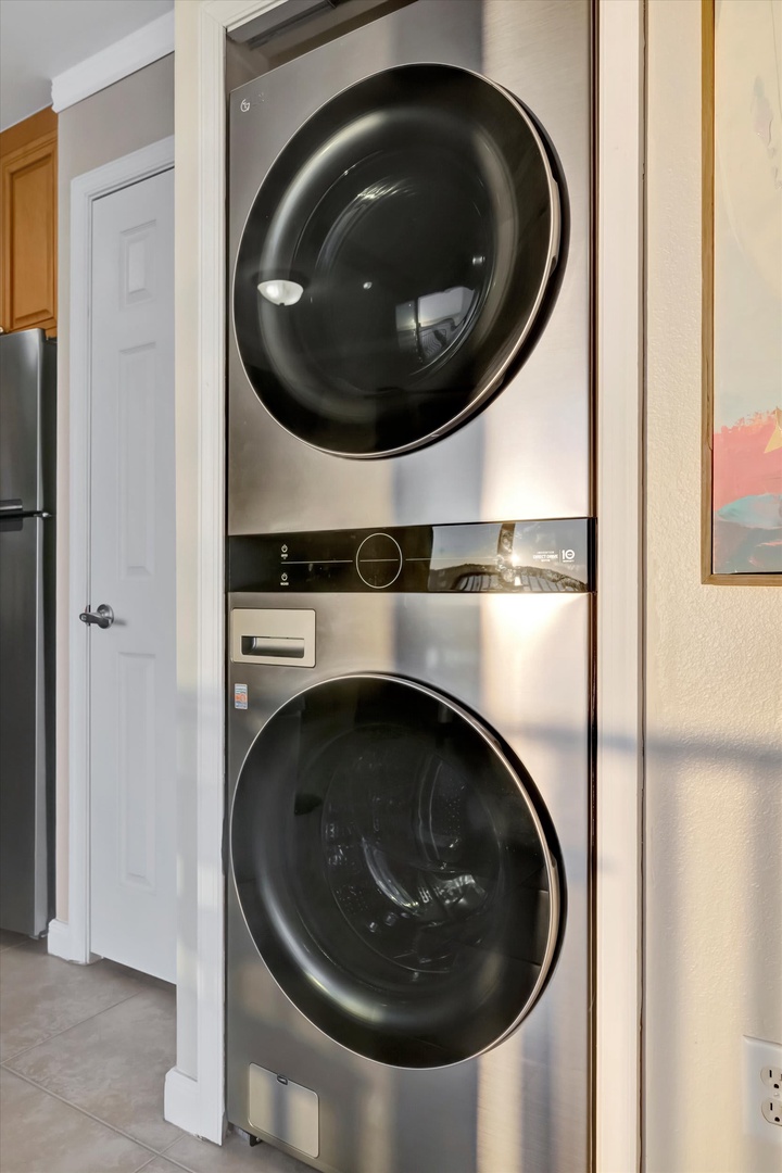 Modern stacked washer and dryer make laundry day effortless during your stay, tucked neatly into a convenient space for your comfort.