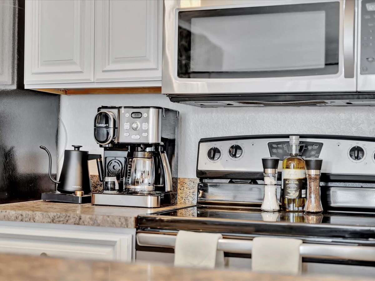 Your fully equipped kitchen invites you to savor that first morning coffee, with a sleek espresso machine and modern appliances ready for every meal or snack you'd like to prepare during your stay.
