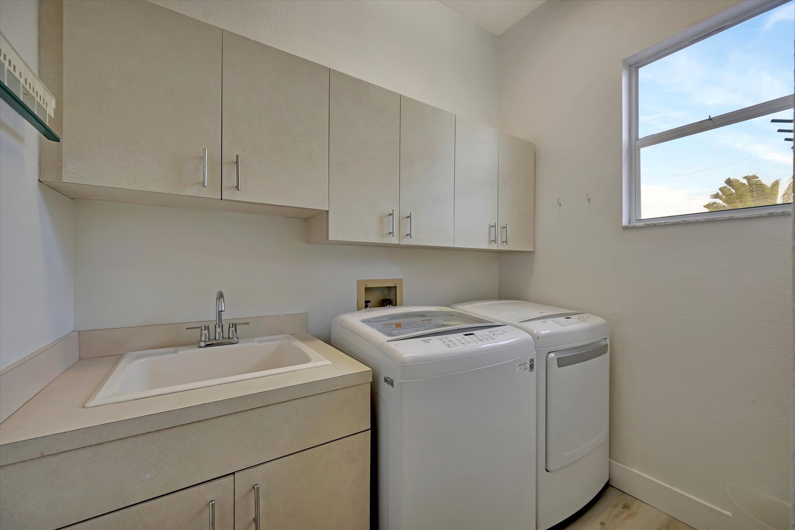 Your dedicated laundry room makes wash day effortless, with a washer and dryer ready whenever you need them, plus a utility sink for added convenience.