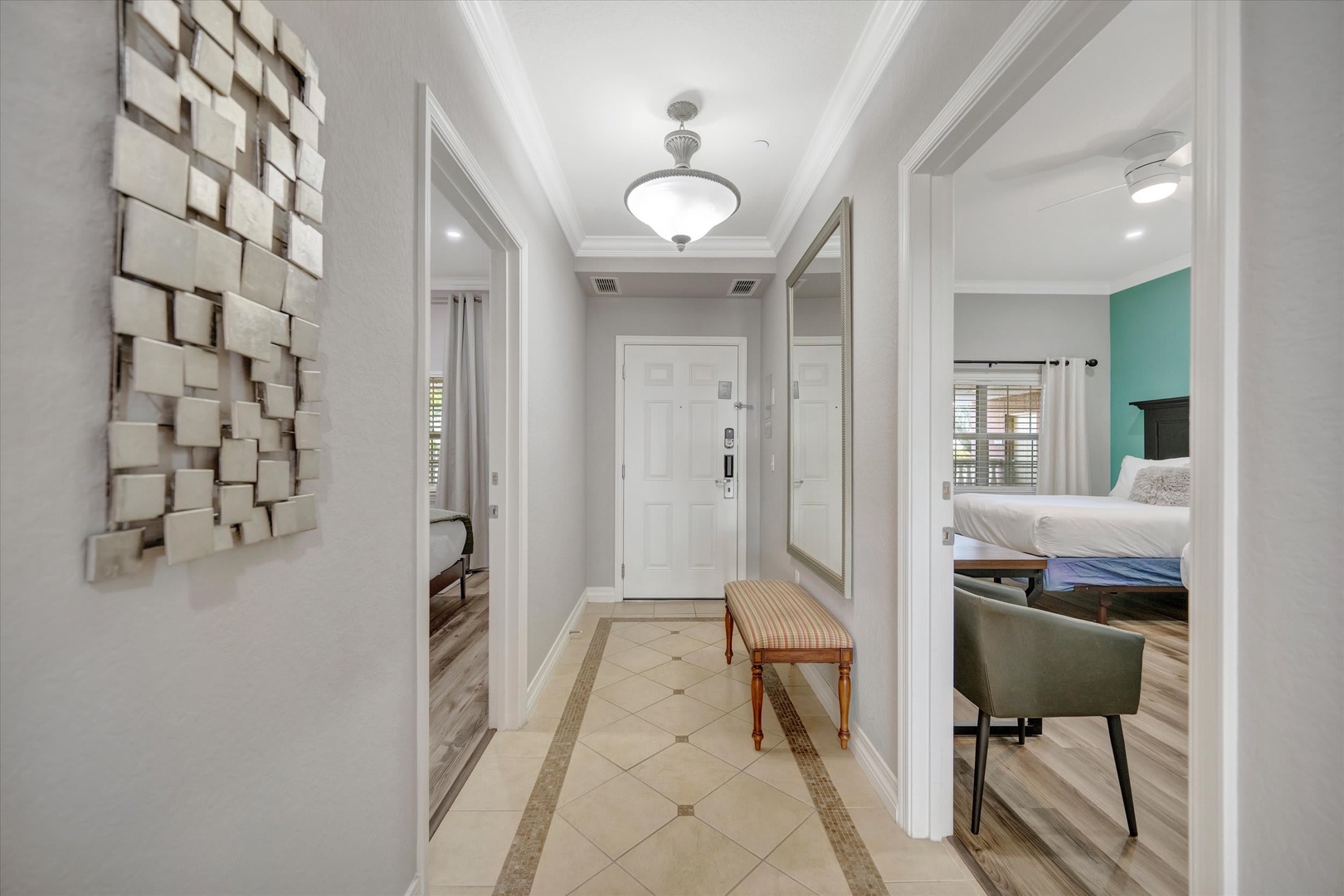 Step into your private retreat through this elegant, light-filled entryway. The thoughtful design and inviting details set the tone for the comfortable escape that awaits you beyond.