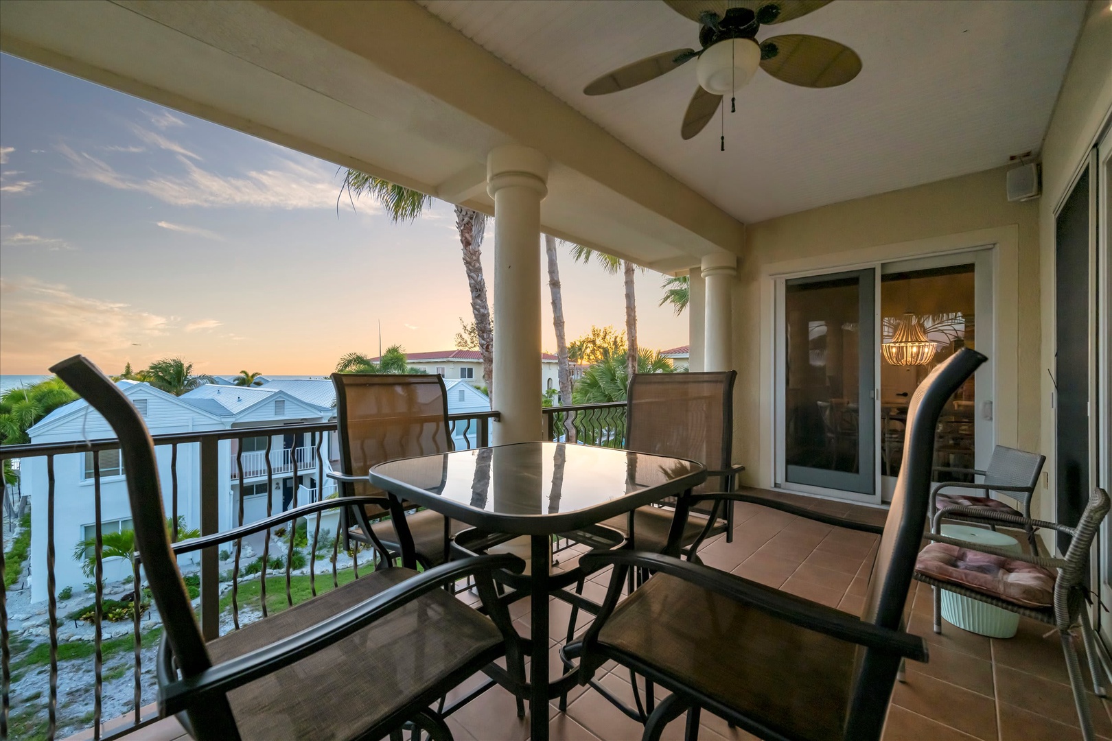 Sip your morning coffee on your private balcony as palm trees sway and the ocean glistens in the distance—your perfect retreat awaits.