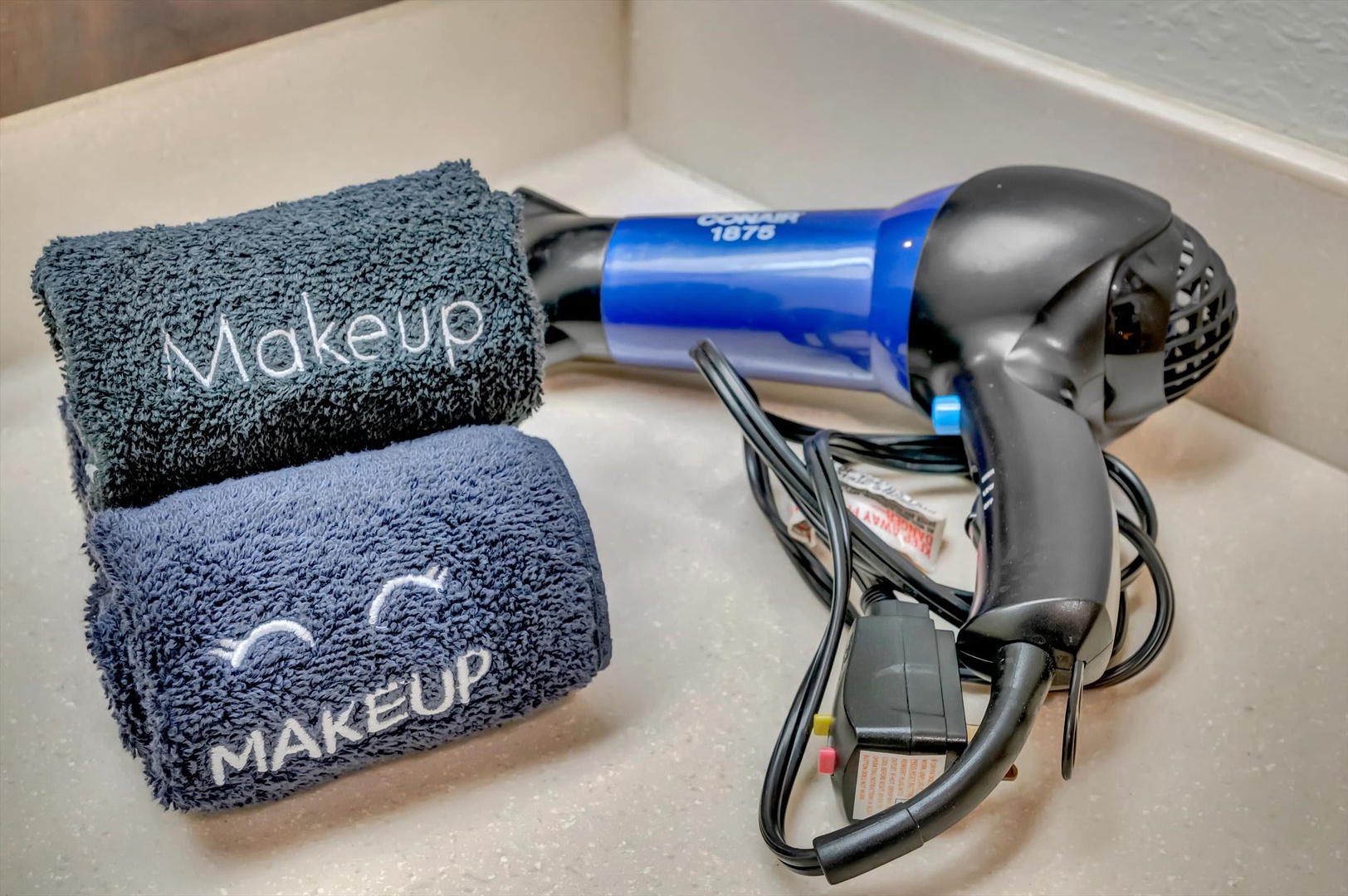 Your thoughtful amenities await—soft towels for makeup removal and a quality hairdryer to help you get ready for whatever adventure calls.